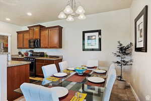 Tiled dining room with an inviting chandelier