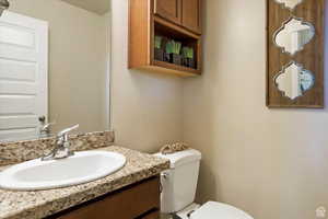 Bathroom featuring vanity and toilet