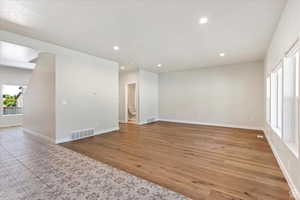 Unfurnished room featuring light wood-type flooring