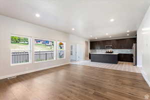 Unfurnished living room featuring light hardwood / wood-style floors