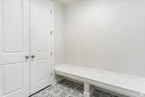 Mudroom featuring light tile patterned flooring