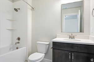 Full bathroom with vanity, toilet, and shower / bathtub combination