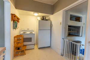 Kitchen featuring white appliances