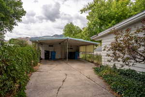 Exterior space featuring a carport