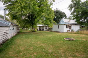 View of yard featuring a fire pit