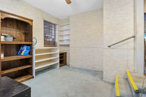 Interior space with ceiling fan and carpet