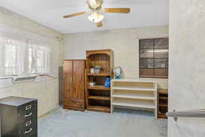 Misc room featuring ceiling fan and carpet