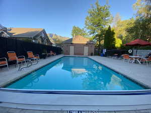 View of pool featuring a patio area and a mountain view