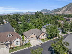 Birds eye view of property with a mountain view