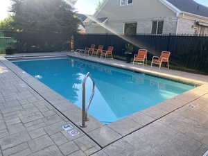 View of swimming pool with a patio