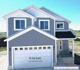 View of front of property with a garage