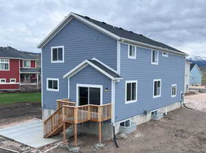 Rear view of house featuring a deck