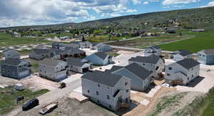 Birds eye view of property with a mountain view