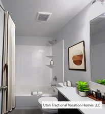 Full bathroom with shower / bath combination with curtain, toilet, a textured ceiling, and vanity