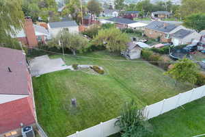 Fully fenced backyard with basketball standard, landscaping and fully automatic sprinkling system.