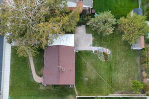 Aerial view of property. Mature trees, newer asphalt shingles