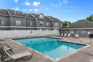 View of swimming pool with a patio area