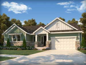 Craftsman-style home featuring a garage, a front yard, and covered porch