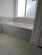 Bathroom with a relaxing tiled tub