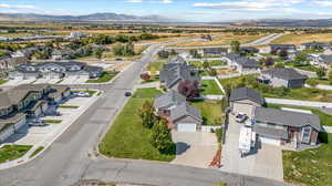 Birds eye view of property with a mountain view