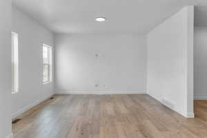 Unfurnished room with light hardwood / wood-style flooring