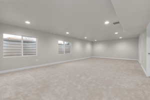 Unfurnished room with light carpet