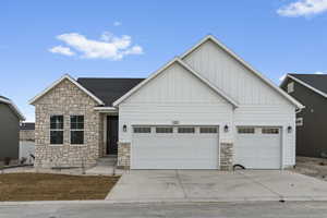 View of front facade featuring a garage