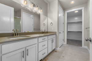 Bathroom with vanity and walk in shower