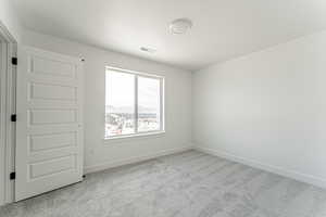 Spare room with carpet flooring and baseboards