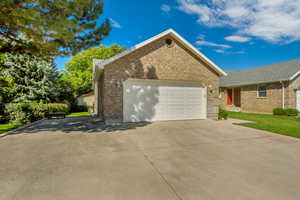 View of side of property with a garage