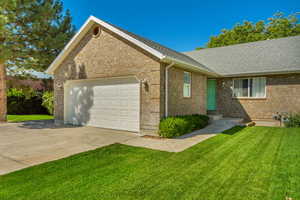 Exterior space with a garage and a front yard