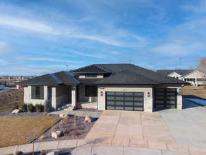 Prairie-style home with a garage