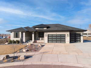 Prairie-style house with a garage