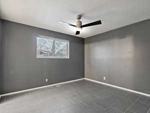 Spare room featuring ceiling fan