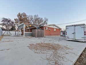 Back of house featuring a storage shed