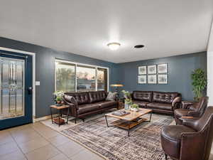 Living room with light tile patterned floors