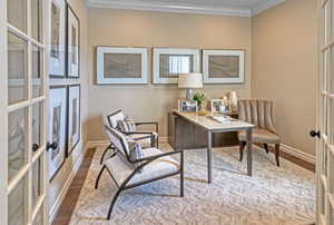 Office area featuring crown molding, french doors, and hardwood / wood-style flooring