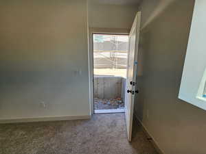 Entryway featuring carpet floors