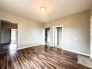 Empty room featuring hardwood / wood-style flooring