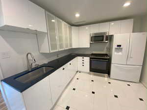 PHOTO TAKEN PRIOR TO TENANT MOVING IN (in 2020): Front Unit Remodeled Kitchen.