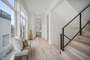 Foyer entrance with a healthy amount of sunlight and light hardwood / wood-style floors