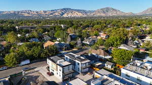 Birds eye view of property with a mountain view