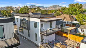 Exterior space with a balcony and a mountain view