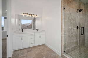 Bathroom with vanity and an enclosed shower