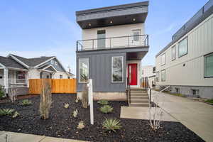 View of front of house with a balcony