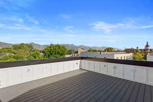 Wooden deck featuring a mountain view