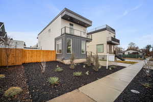 Front of house featuring a balcony