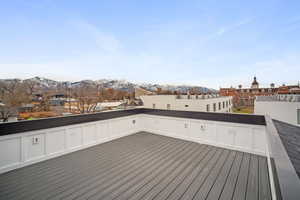 Wooden deck featuring a mountain view