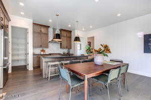 Dining room with dark wood-type flooring