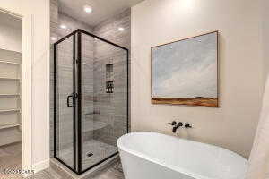 Bathroom with plus walk in shower